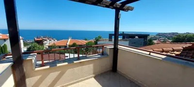 a balcony with a view of the ocean at Sozopol Paradise view in Sozopol