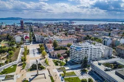 an aerial view of a city with the ocean at HOT Main Square Newly Built Modern Apartment in Burgas City