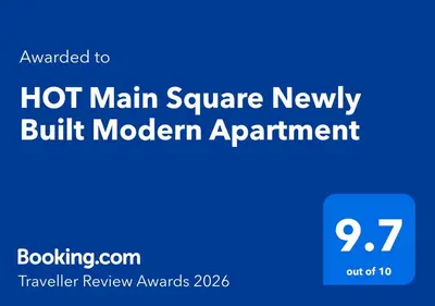 a blue sign that says hot main square newly built modern apartment at HOT Main Square Newly Built Modern Apartment in Burgas City