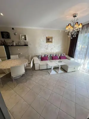 a living room with a couch and a table at 2 Apartment Verano Del Mar Sozopol in Sozopol
