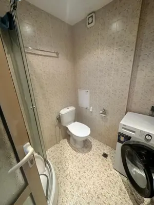 a bathroom with a toilet and a sink at Apart Hotel Avalon in Sunny Beach