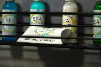 a shelf with several bottles of fermented kombucha at Super Cozy Central Apartment in the Heart of Varna in Varna City