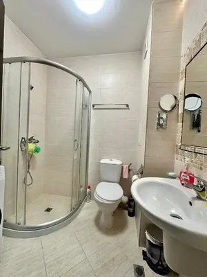 a bathroom with a shower and a toilet and a sink at Studio at Kaskadas A44 in Sunny Beach
