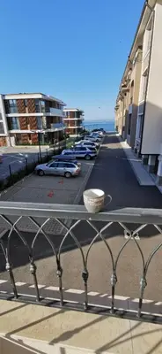 a row of cars parked in a parking lot at Aх, морето in Burgas City