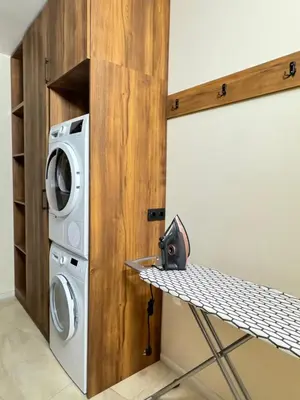 a laundry room with a washer and dryer at South Bay Luxury Apartment in Varna City