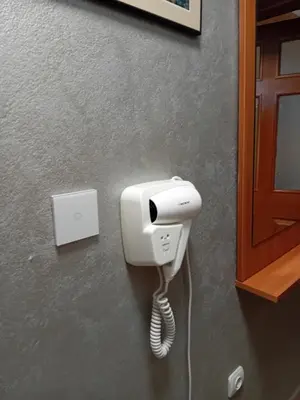 a phone is hanging on a wall at Laura 2 in Primorsko