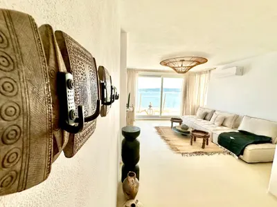 a living room with a couch and a table at Casa de oro Lujo in Sozopol
