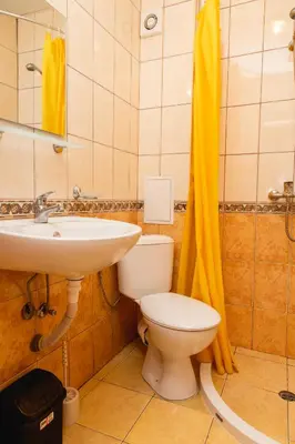 a bathroom with a toilet and a sink at Studio in the Center of Sunny Beach by Flat Mаnаger in Sunny Beach