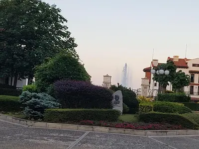 a view of a park with flowers and a building at Bogdanov in Lozenets