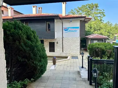 a house with a sign on the side of it at Sozopol Dreams - Apartment 1 in Sozopol