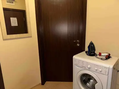 a washing machine with a phone on top of it at Sozopol Dreams - Apartment 1 in Sozopol