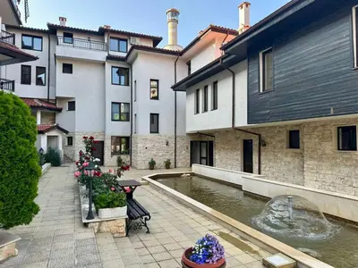 a courtyard with a fountain in front of a building at Sozopol Dreams - Apartment 1 in Sozopol