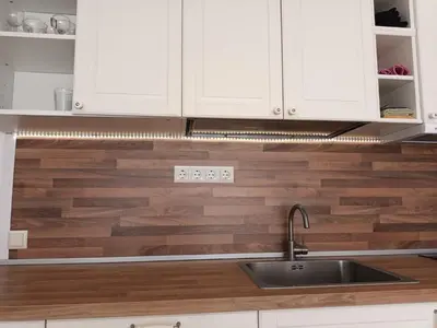 a kitchen with white cabinets and a sink at Sun Holidays Byala in Byala