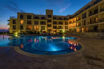 a large swimming pool in front of a building at Beachfront one bedroom apartment DIAMOND BEACH Burgas Sarafovo Студио в Diamond beach Сарафово in Burgas City