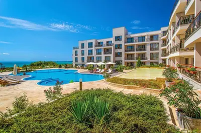 an exterior view of a resort with a swimming pool at Beachfront one bedroom apartment DIAMOND BEACH Burgas Sarafovo Студио в Diamond beach Сарафово in Burgas City