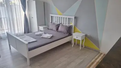 a childs bedroom with a bed with a geometric wall at Beachfront one bedroom apartment DIAMOND BEACH Burgas Sarafovo Студио в Diamond beach Сарафово in Burgas City