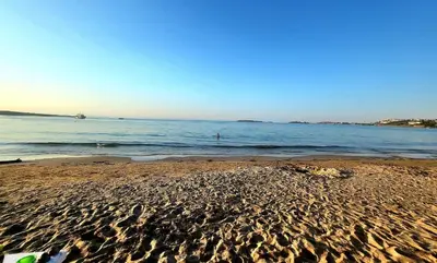 a sandy beach with the ocean in the background at Apartment Anastasia Santa Marina in Sozopol