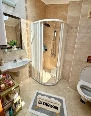 a bathroom with a shower and a sink and a toilet at Apartment Anastasia Santa Marina in Sozopol