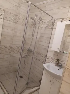a bathroom with a shower and a sink at GREAT Apartament in Burgas City