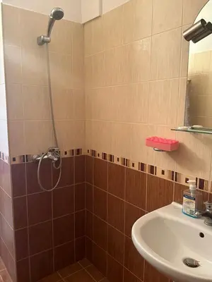 a bathroom with a shower and a sink at апартамент под наем виа понтика in Sozopol