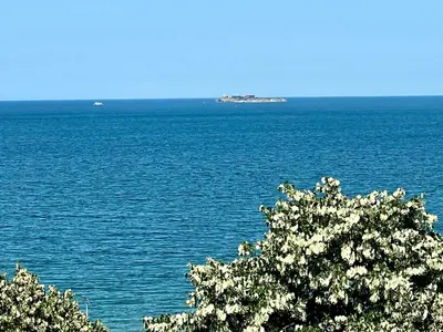 an island in the middle of a large body of water at Vista Sul Mare V in Kraymorie