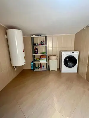 a laundry room with a washer and a washing machine at Vista Sul Mare V in Kraymorie