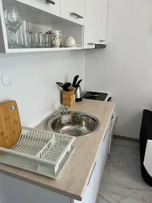 a kitchen with a sink and a counter top at Studio Dream Мечта in Sunny Beach