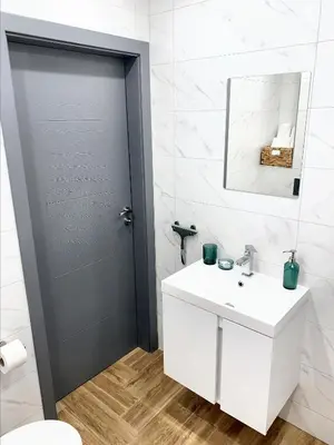 a bathroom with a white sink and a mirror at 