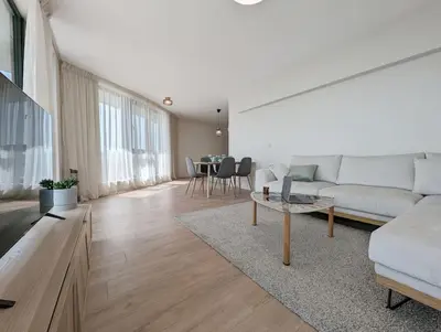 a living room with a couch and a table at Foros Apartment in Kraymorie