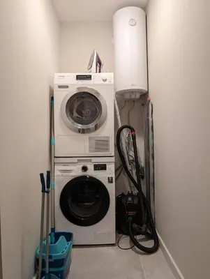 a washer and dryer in a corner of a room at Foros Apartment in Kraymorie