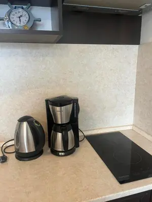 a coffee maker sitting on a counter next to a toaster at На гости в Созопол in Sozopol
