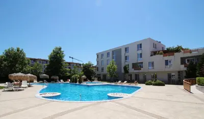 a swimming pool in a courtyard of a building at Doris Beach apartment D06 in Burgas City