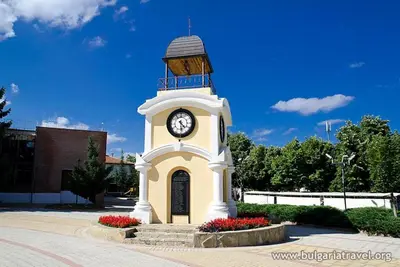 a clock tower in front of a building at Nice 2 Bedrooms With Ocean View In Byala in Byala