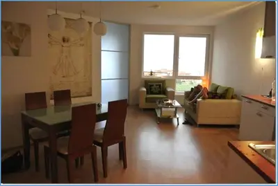 a kitchen and living room with a table and chairs at Nice 2 Bedrooms With Ocean View In Byala in Byala