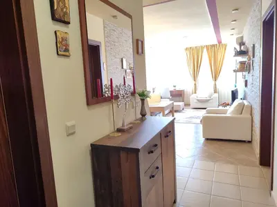 a living room with a counter and a living room at Green Life Sozopol in Sozopol