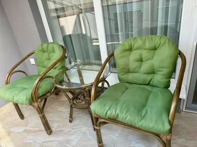 two chairs and a glass table and a glass table and chairs at South Beach Apartment Primorsko in Primorsko