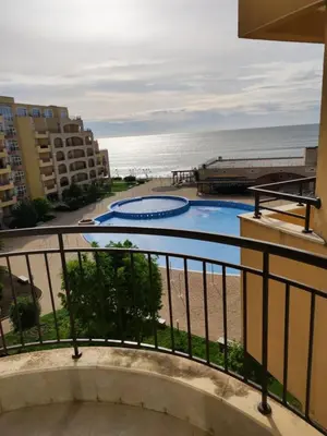 a view of the beach from the balcony of a apartment at Piękny apartament nad morzem czarnym in Aheloy