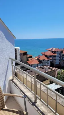 a balcony with a view of the ocean and buildings at Wspaniały apartament w kompleksie Galateya in Sveti Vlas