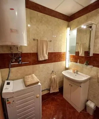 a bathroom with a sink and a mirror at Riviera Fort Beach Apartment in Ravda