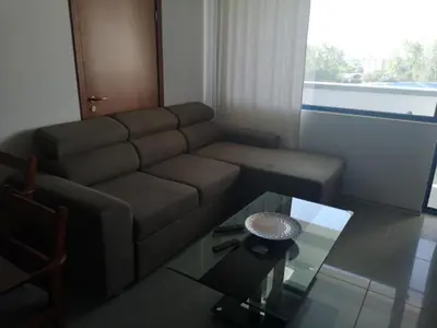 a living room with a couch and a glass table at California complex in Sunny Beach