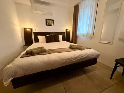 a bedroom with a large bed in a room at Arthotel Oscar I Sozopol in Sozopol