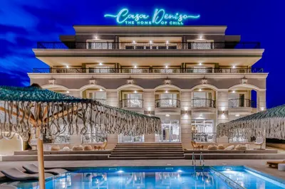 a hotel with a swimming pool in front of a building at Casa Deniso - The Home of Chill in Byala