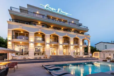 a hotel with a swimming pool in front of a building at Casa Deniso - The Home of Chill in Byala