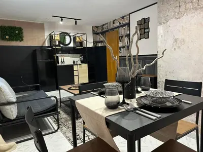 a living room with a table and a dining room at Apartment Blue Summer II in Varna City