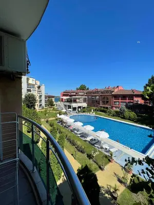 a view of a swimming pool from a balcony at 'Oasis' Ravda Apartment, Nessebar in Ravda