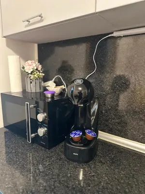 a coffee maker sitting on top of a counter at Оазис in Ravda