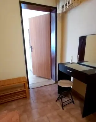 a room with a desk and a door with a stool at Stela in Burgas City