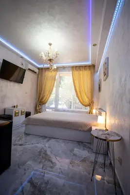 a bedroom with a large bed and a window at AR Luxury Apartments Ravda in Ravda