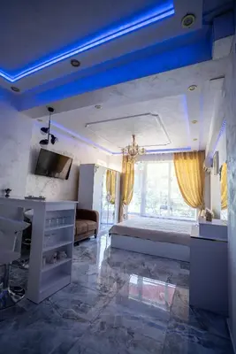 a large bedroom with a large bed and a tv at AR Luxury Apartments Ravda in Ravda