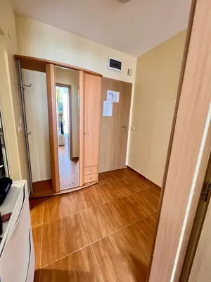 an empty room with a door and wooden floors at Panorama Dreams Apartment in Sveti Vlas